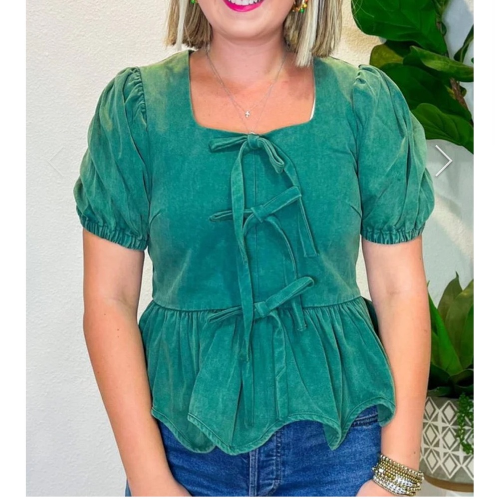 Emerald green peplum top with bows
